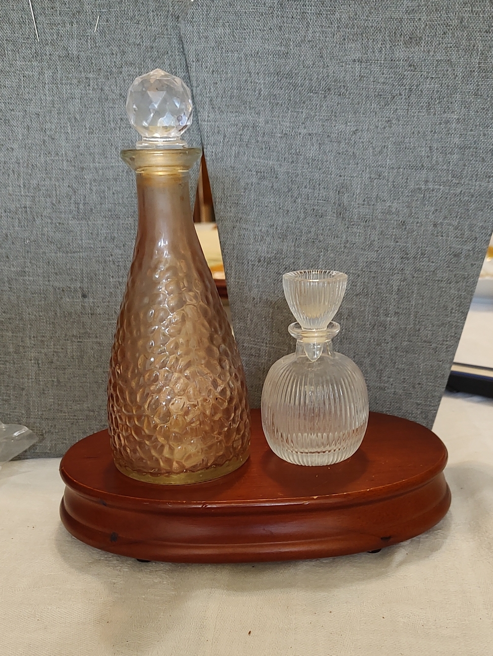 Pink Hammered Glass Perfume Bottle And A Clear Ribbed Perfume Bottle
